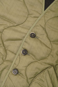 Militärgrüne Steppweste mit Rücken aus anthrazitfarbener Wolle