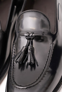 Loafer with tassels in shiny brushed black calfskin